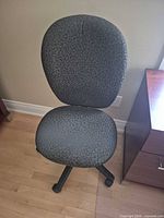 Front view of armless swivel desk chair