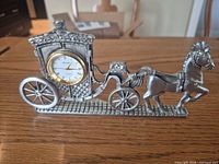 Full view of pewter horse and carriage clock