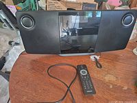 Front view of Philips DCM278 unit, remote and cable visible