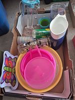 Box view showing pitchers, tumblers, stack cups, plates