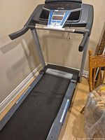 Full view of ProForm treadmill showing belt, frame and console