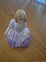 Front angled view of Royal Doulton Rose figurine