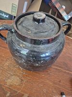 Full view of crock with lid and handles