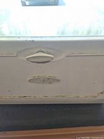 Front view showing color, emblem and handle