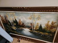 Full view of framed oil landscape painting