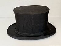 Side view of black collapsible top hat