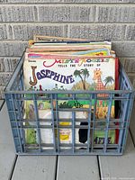 Crate containing stack of children’s LPs