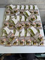 Stacked view of twenty-six boxed Knork matte finish 4-piece sets