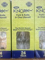 Front of Knork 24-pack box showing branding and window revealing clear utensils