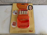 Front of sealed Furi Sharp ’n Go Rachael Ray knife sharpener package