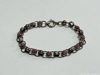 Full view of 800 silver floral link bracelet laid flat