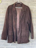 Front view of brown suede jacket on hanger