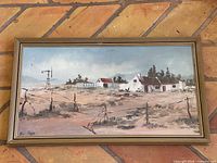 Full view of framed painting on wall