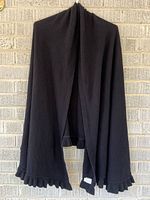 Full view of black stole hanging to show size and drape