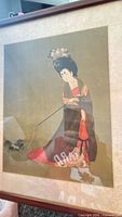 Full view of framed print with Asian woman holding rod