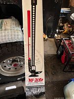 Front of sealed box showing full image of red Hi-Lift jack