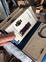 Stack of three sealed Fitbit Blaze accessory band boxes