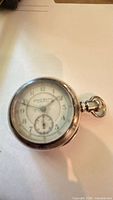 Closed view of pocket watch showing overall appearance and size