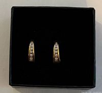 Front view of earrings showing diamonds