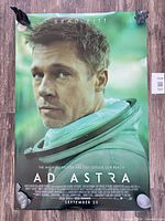 Full view of the unframed Ad Astra poster pinned at corners showing overall condition