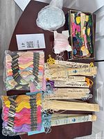 Overview of sealed floss packs, Artsyl Rope cards, loose box, thread ball and spool