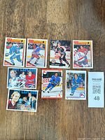 Nine Guy Lafleur cards laid out in three rows