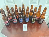 Front view of 11 Labatt Blue NHL logo bottles on tabletop