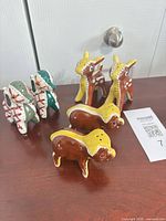 All six ceramic animal shakers grouped on surface