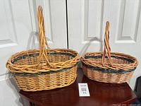 Both wicker baskets side by side showing size difference and handles