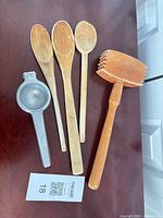 All five utensils laid out on tabletop