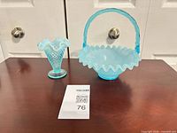 Basket and vase side by side on table