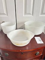 All three nesting milk glass mixing bowls grouped together