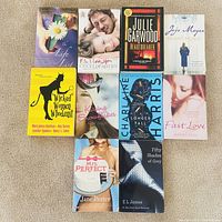 All ten paperback novels laid out