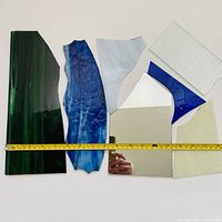 all glass pieces with ruler for scale