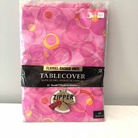 Front of packaged pink circular-pattern flannel-backed vinyl tablecover