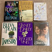 All six hardcover novels laid out showing covers