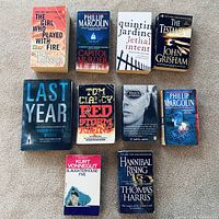 All ten paperback books laid out in two rows