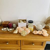 All candles and holders displayed on dresser