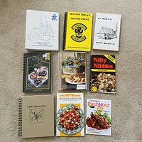All nine cookbooks laid out