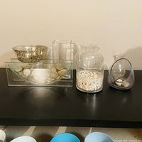 Full group of glass vessels on black surface