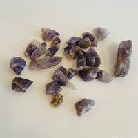 All amethyst pieces spread out on white background