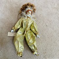 Front of clown doll with tag visible