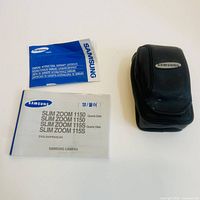 Manuals and black Samsung camera case