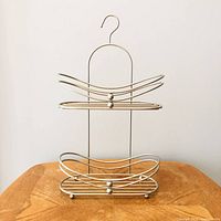 Front view of two-tier metal shower caddy