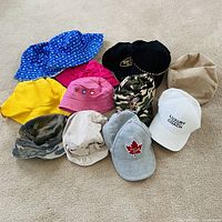 Group shot showing all hats laid out