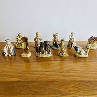 All 10 Wade Nursery Rhyme figurines lined on table