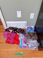 All scarves laid out on floor