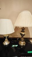 Both lamps side by side on black surface