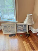 Overview of both framed prints and lamp