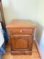 Light pine cabinet nightstand front view